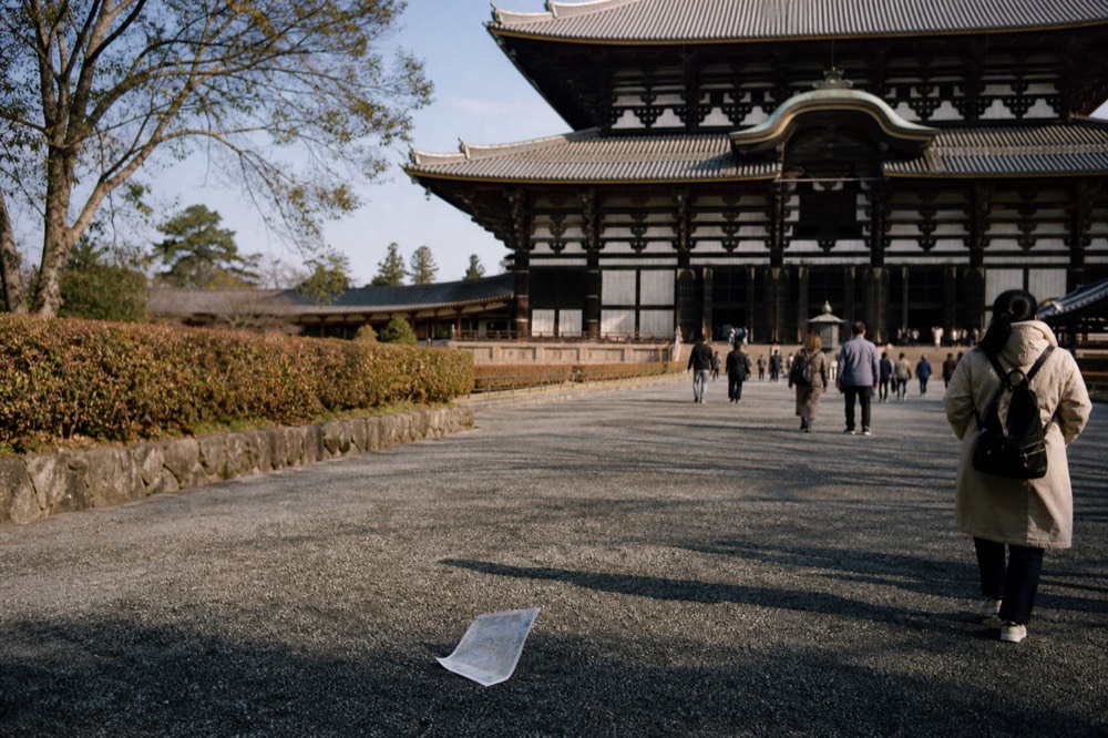 The wooden facade of the Todai-ji Great Buddha hall seen from its stone approach