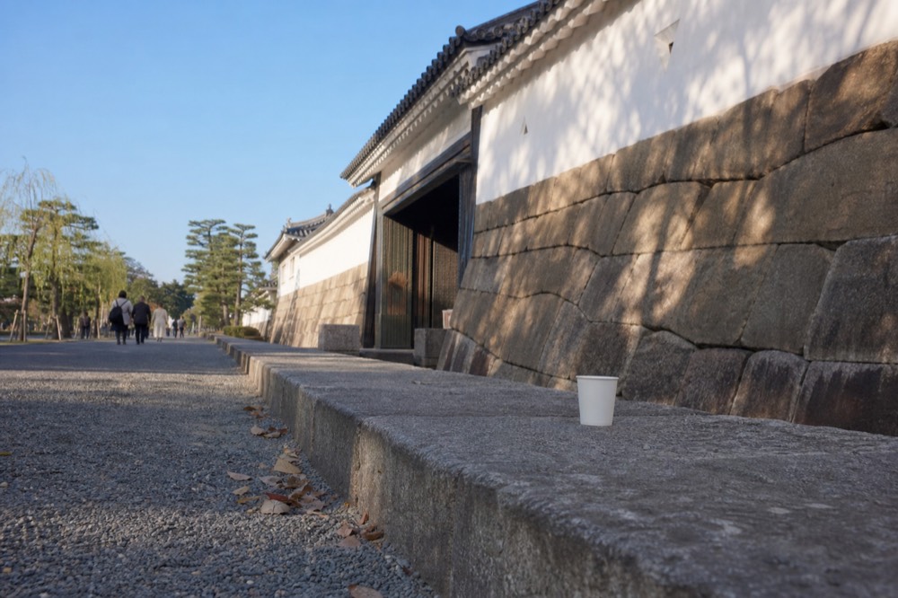 The stone walls of Nijo Castle under a clear morning sky